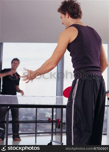 men playing table tennis