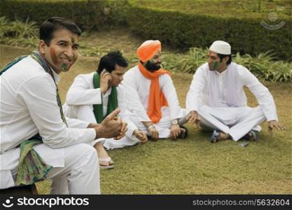 Men relaxing during Holi