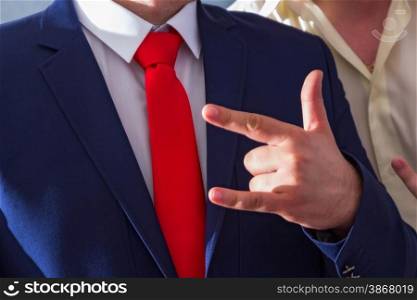 men&rsquo;s blue suit and red tie