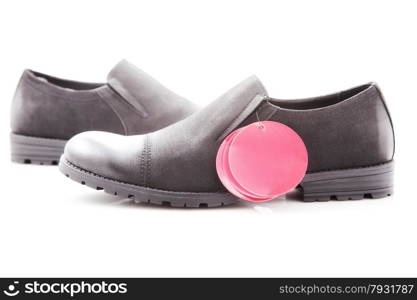 men&rsquo;s dress shoes with red price tag on a white background, close-up