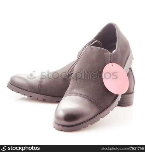 men&rsquo;s dress shoes with red price tag on a white background, close-up
