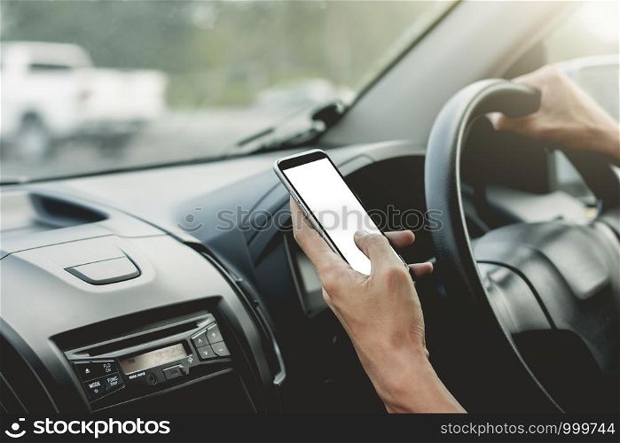 Men's hands are using a smartphone while driving, mockup phone.