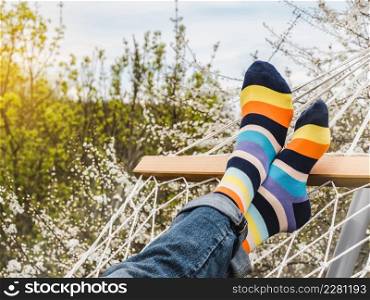 Men&rsquo;s legs and bright socks. Close-up, outdoor. Style, beauty and elegance concept. Men&rsquo;s legs and bright socks. Close-up, outdoor