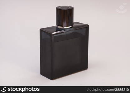 men&rsquo;s perfume in bottle isolated on gray background