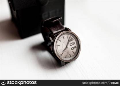 men's watch on a light background.Accessories for a businessman.. men's watch on a light background. Accessories for a businessman