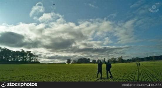 Men shooting grouse, Berwickshire, Scotland