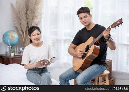 Men sitting guitar and women holding books and singing.