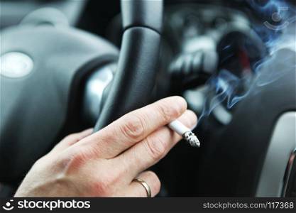 Men smoking in car
