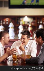 Men speak out for a beer at the bar