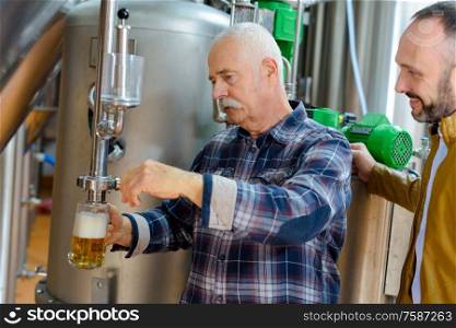 men tasting the fresh beer
