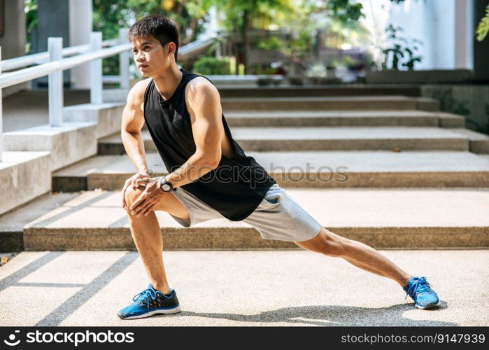 Men warm up before and after exercising. Selective focus.