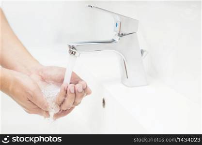 Men wash their hands and protect them from the virus, Covid 19 and bacteria.