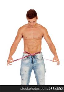 Men with perfect abs measuring his waist isolated on a white background