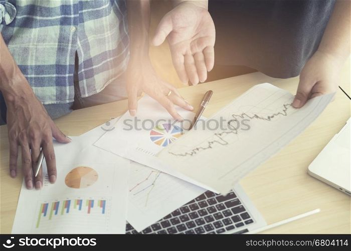 men working with business document and laptop computer notebook, vintage tone