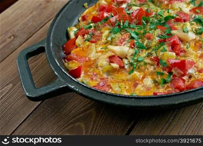 Menemen - traditional Turkish dish.includes eggs, onion, tomato, green peppers, and spices .commonly eaten for breakfast