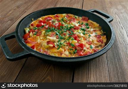 Menemen - traditional Turkish dish.includes eggs, onion, tomato, green peppers, and spices .commonly eaten for breakfast