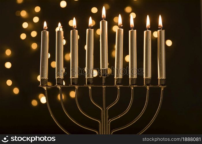 menorah with candles near abstract garland lights . Resolution and high quality beautiful photo. menorah with candles near abstract garland lights . High quality and resolution beautiful photo concept