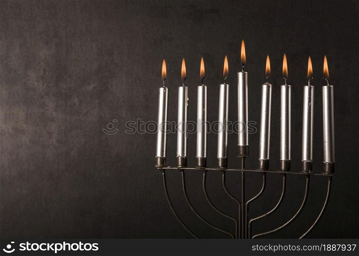 menorah with candles near gray wall . Resolution and high quality beautiful photo. menorah with candles near gray wall . High quality and resolution beautiful photo concept