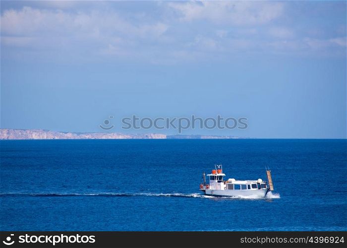 Menorca Son Saura beach in Ciutadella boat sailing at Balearic islands