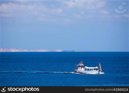 Menorca Son Saura beach in Ciutadella boat sailing at Balearic islands