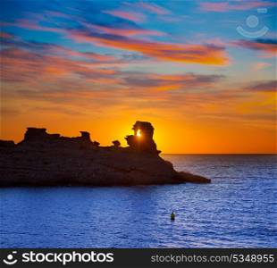 Menorca sunset in Cala Morell at Ses torretes beach Balearic Islands