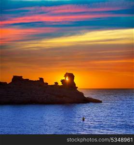 Menorca sunset in Cala Morell at Ses torretes beach Balearic Islands