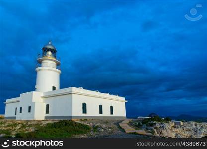 Menorca sunset in Faro Far de Caballeria Lighthouse at Balearic Islands es Mercadal