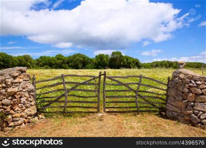 Menorca traditional wooden gate in spring at Balearic islands of Spain