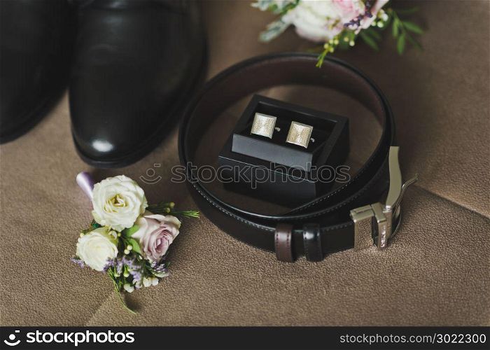 Mens shoes, watch and ring on the chair.. Mens accessories on the chair 545.