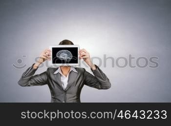 Mental ability. Woman holding tablet pc with brain concept