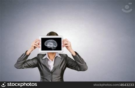 Mental ability. Woman holding tablet pc with brain concept