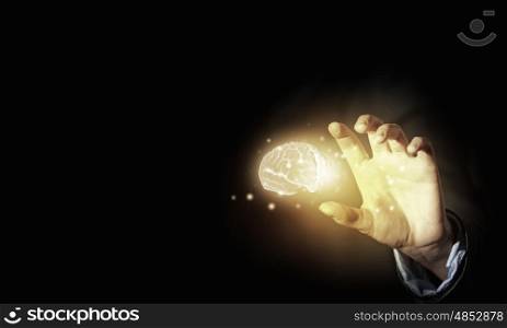Mental health. Close up of businessman holding digital image of brain in palm