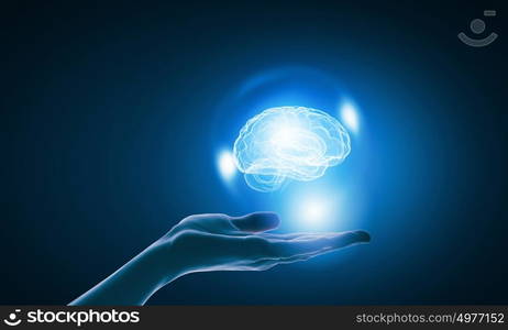 Mental health. Close up of businessman holding digital image of brain in palm