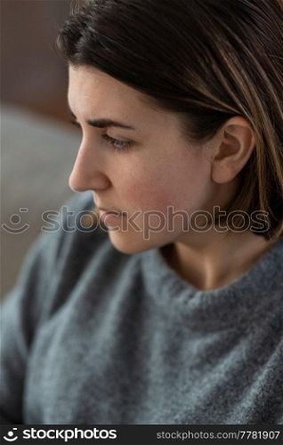 mental health, psychological problem and depression concept - close up of sad crying woman at home. close up of sad crying woman at home