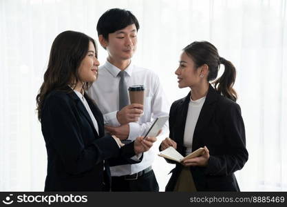 Mentor, manager with coffee advice younger colleagues in workplace. Businesspeople discussing or planning financial project strategy, talking together for harmony and strong teamwork in office concept. Manager with coffee advice colleagues as concept of harmony in office.