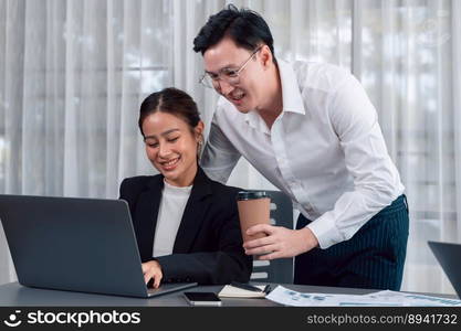 Mentor, manager with coffee advice younger colleagues in workplace. Couple businesspeople discussing financial strategy, working together for harmony and strong teamwork in office concept. Manager with coffee advice colleagues as concept of harmony in office.