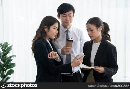 Mentor, manager with coffee advice younger colleagues in workplace. Businesspeople discussing or planning financial project strategy, talking together for harmony and strong teamwork in office concept. Manager with coffee advice colleagues as concept of harmony in office.