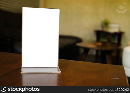 Menu frame space for text marketing promotion standing on wood table in Bar restaurant cafe