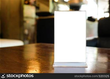 Menu frame space for text marketing promotion standing on wood table in Bar restaurant cafe
