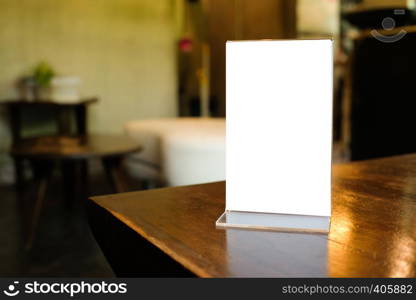 Menu frame space for text marketing promotion standing on wood table in Bar restaurant cafe