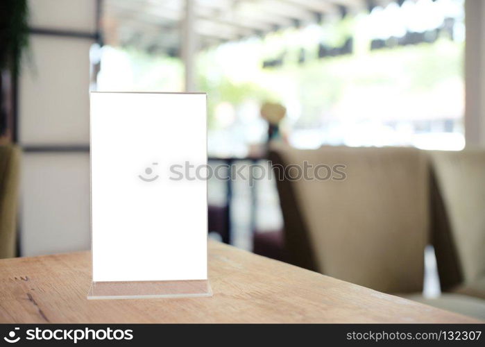 Menu frame standing on wood table in Bar restaurant cafe. space for text marketing promotion