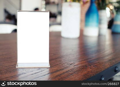 Menu frame standing on wood table in Bar restaurant cafe. space for text marketing promotion