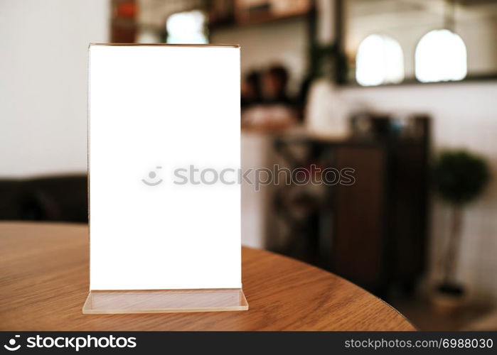 Menu frame standing on wood table in Bar restaurant cafe. space for text marketing promotion