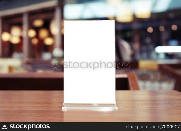 Menu frame standing on wood table in Bar restaurant cafe. space for text marketing promotion