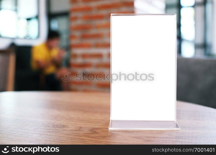 Menu frame standing on wood table in Bar restaurant cafe. space for text marketing promotion