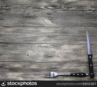 Menu. Good background to create restaurant menus, cafes bars, a wooden table with fork and knife. Can be used for restaurante or bar menu list.