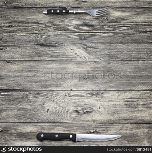 Menu. Good background to create restaurant menus, cafes bars, a wooden table with fork and knife. Can be used for restaurante or bar menu list.