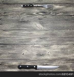Menu. Good background to create restaurant menus, cafes bars, a wooden table with fork and knife. Can be used for restaurante or bar menu list.