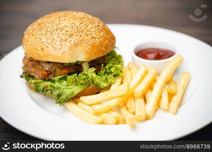 menu with delicious juicy burger and fries with sauce on a plate