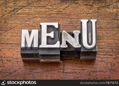 menu word in vintage metal type printing blocks over grunge wood